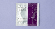 Red Container - 002 Micro Tight Condoms 12's Pack photo